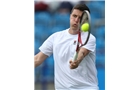 EASTBOURNE, ENGLAND - JUNE 14: Ken Skupski of Great Britain plays a forehand against Remi Boutillier of France during their Men's Singles qualifying match on day one of the Aegon International at Devonshire Park on June 14, 2014 in Eastbourne, England.  (Photo by Steve Bardens/Getty Images)